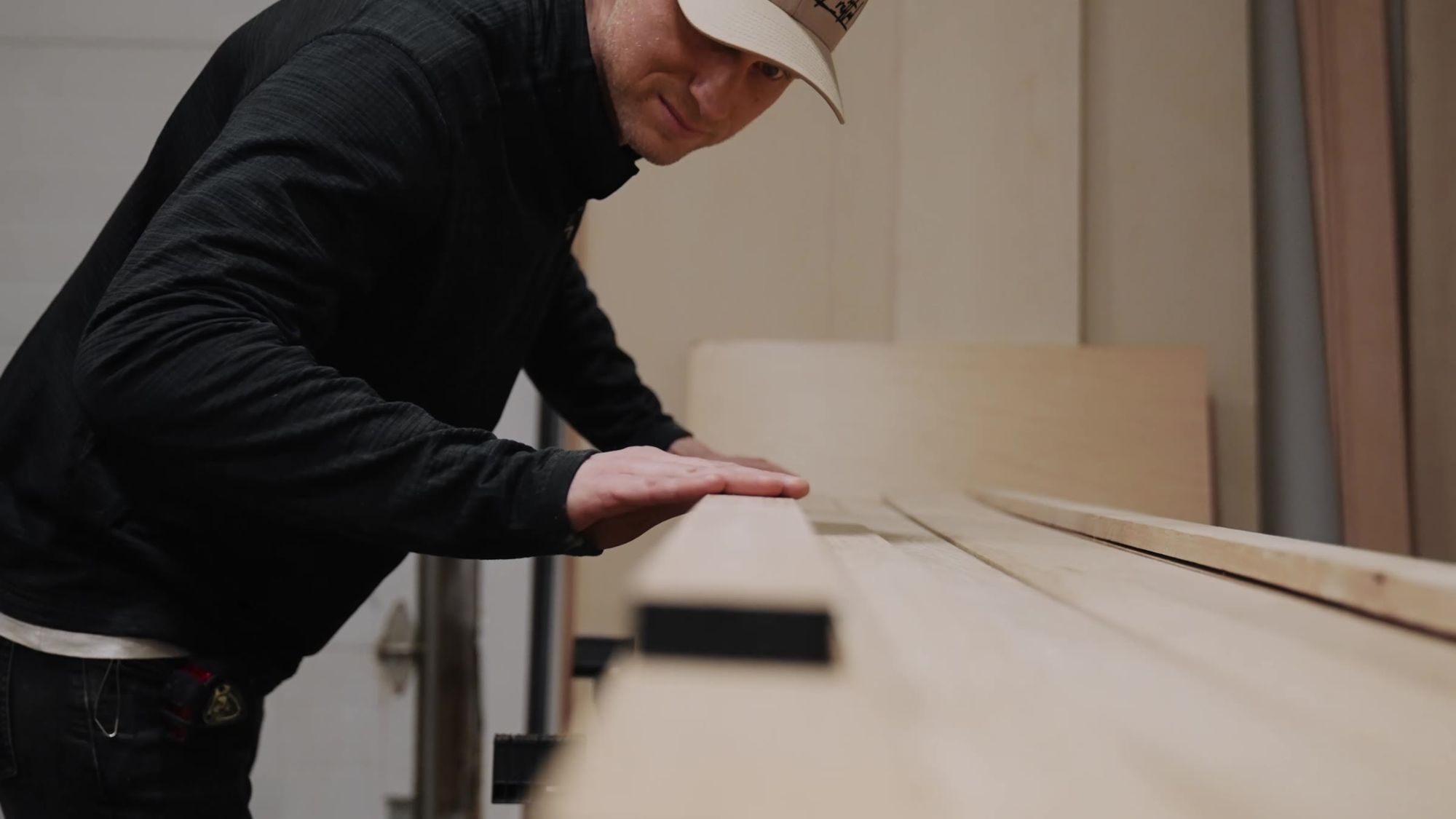 Running a hand along a panel to check the surface