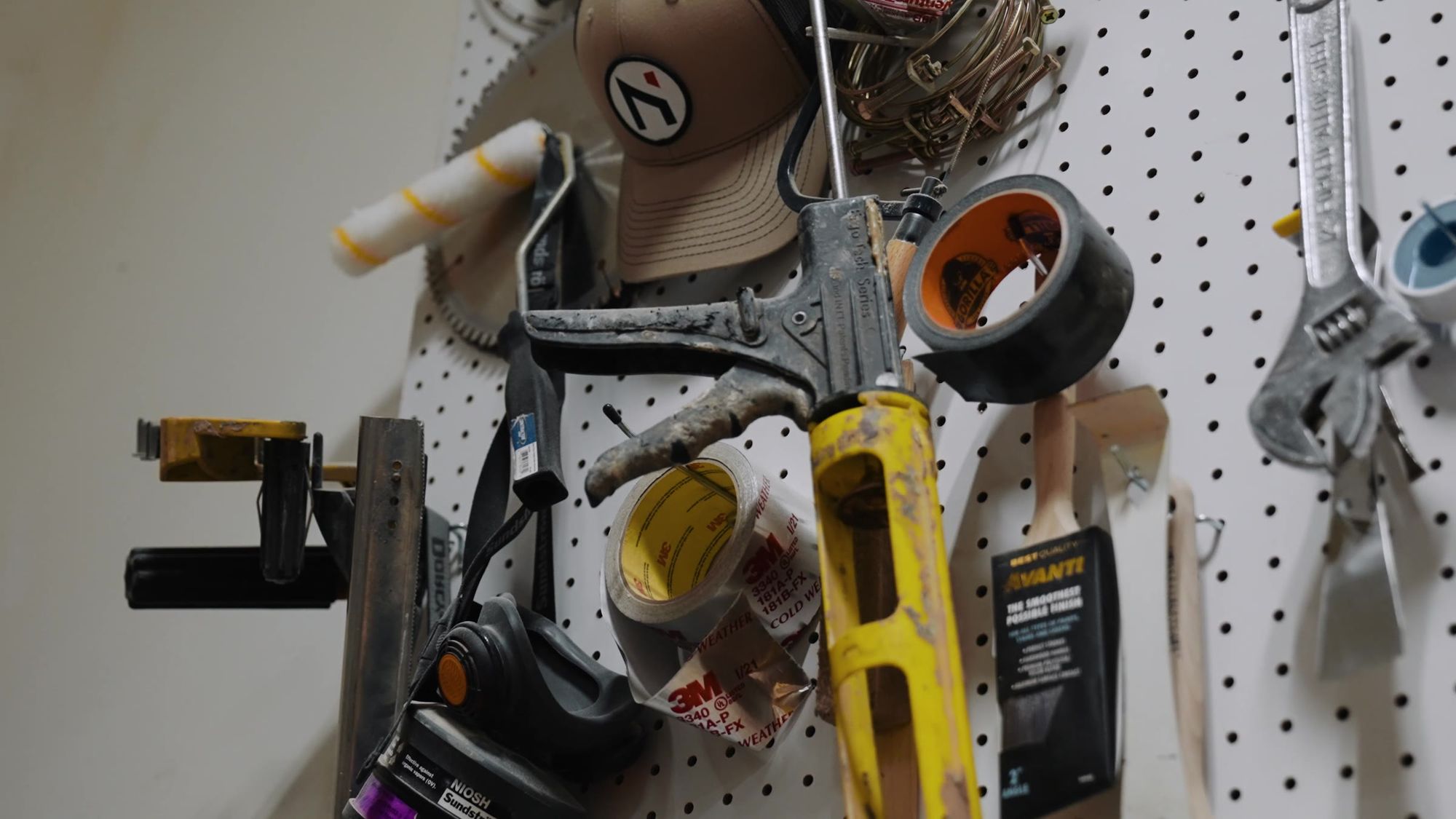 Hand tools hanging on the shop's pegboard